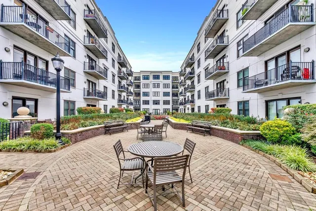 a swimming pool with outdoor seating and yard
