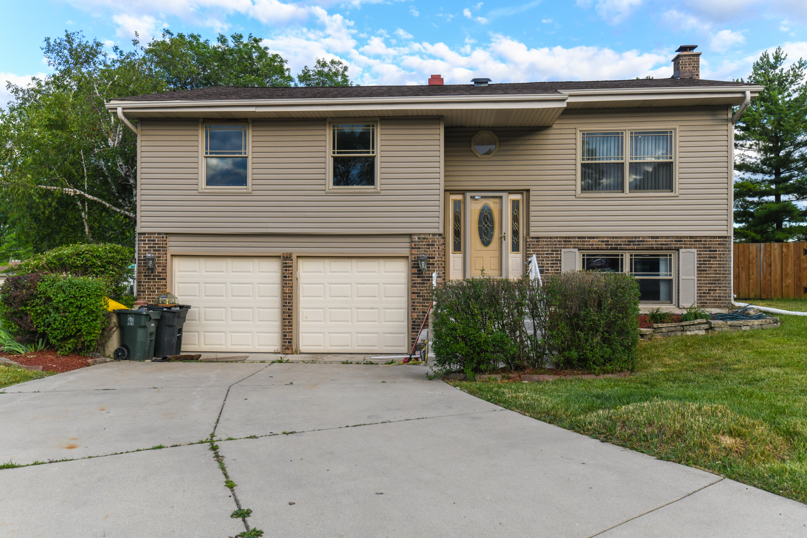 310 Dancing Water Court Carol Stream, IL 60188 - Photo 1 of 26 a front view of a house with a yard