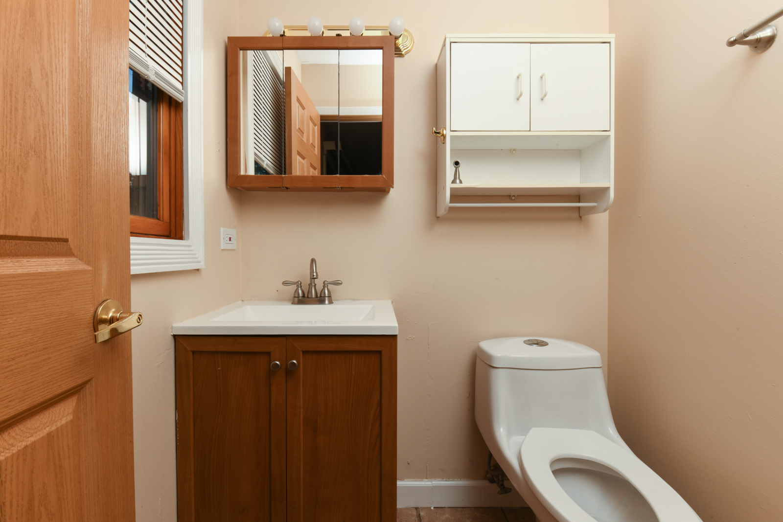 310 Dancing Water Court Carol Stream, IL 60188 - Photo 14 of 26 a bathroom with a toilet sink and mirror