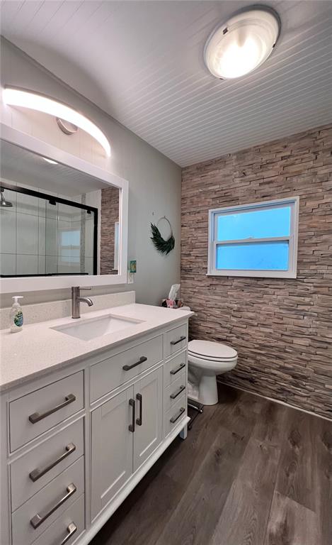1100 South Belcher Road, Unit 772 Largo, FL 33771 - Photo 31 of 84 a bathroom with a toilet a double vanity sink and a mirror