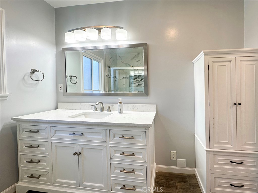 7508 Brookmill Road Downey, CA 90241 - Photo 14 of 20 a bathroom with a sink a vanity and a mirror