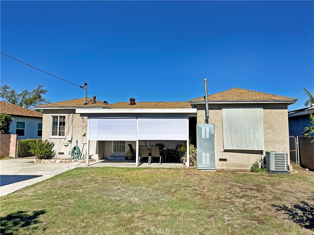 7508 Brookmill Road Downey, CA 90241 - Photo 17 of 20 a front view of a house with a yard and garage