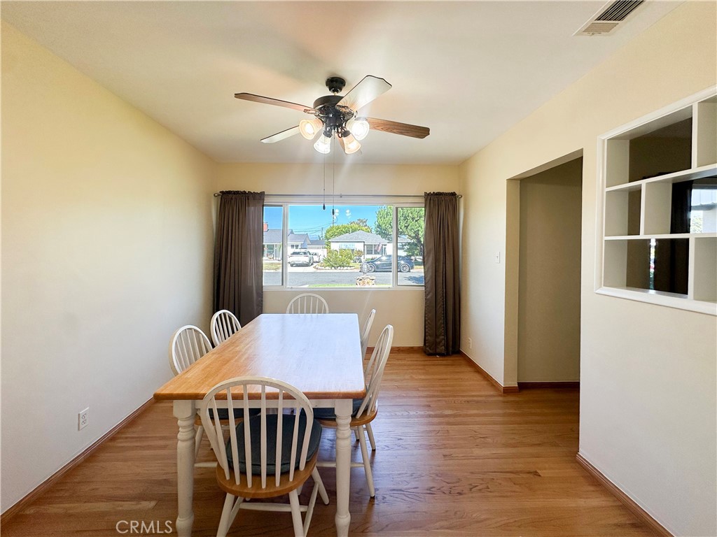 7508 Brookmill Road Downey, CA 90241 - Photo 6 of 20 a view of a dining room with furniture window and wooden floor