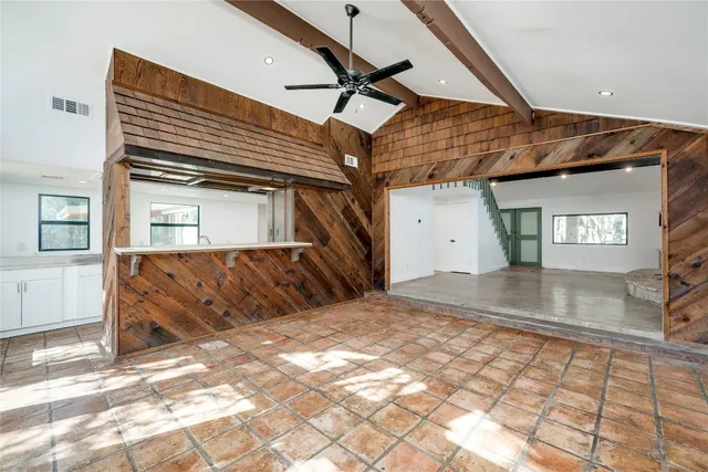 a kitchen with stainless steel appliances granite countertop a sink and a granite counter tops