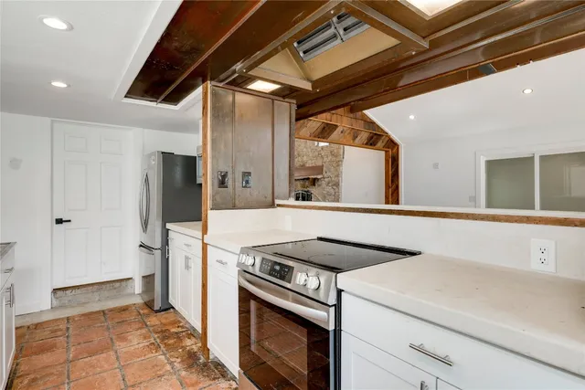 a kitchen with a stove and a microwave