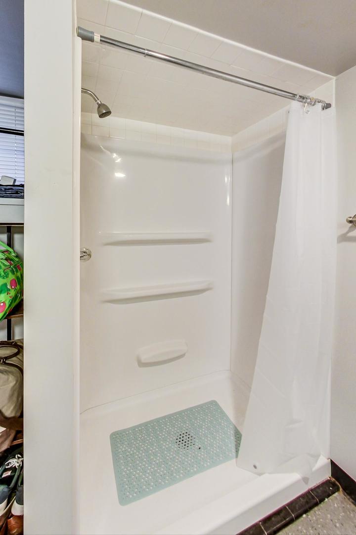 1216 Olive Road Homewood, IL 60430 - Photo 30 of 40 a view of walk in closet with empty racks