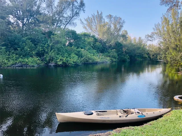 an aerial view of a house with lake view