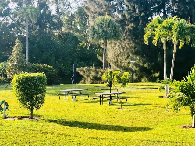 a view of a swimming pool with an outdoor seating