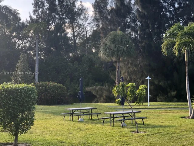 a view of a swimming pool with a yard