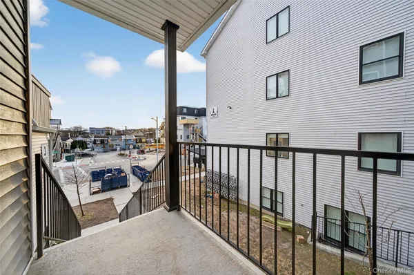 a balcony view with a floor to ceiling window