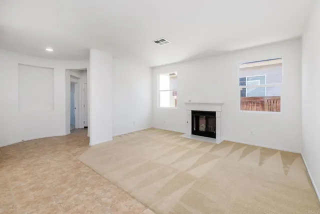 a view of a hallway with stairs