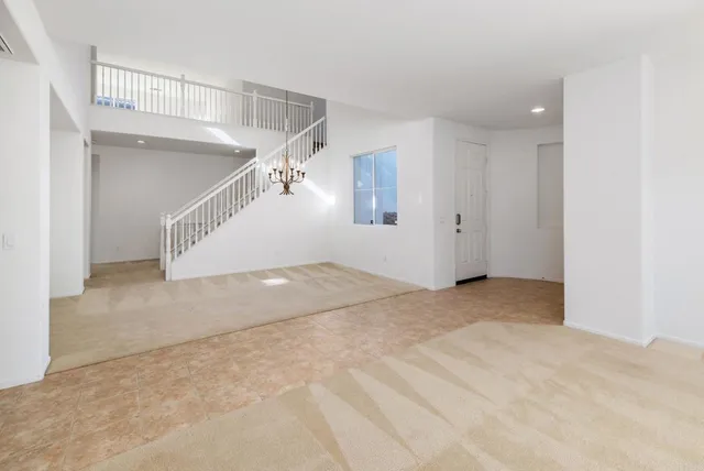 a view of empty room with a fireplace