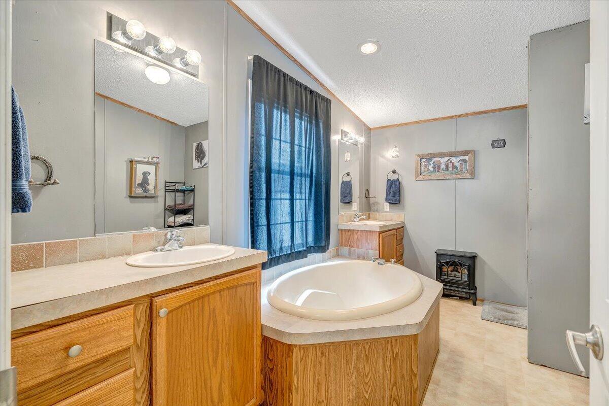 91 Homestead Road New Castle, VA 24127 - Photo 24 of 44 a bathroom with a sink a toilet a mirror and shower