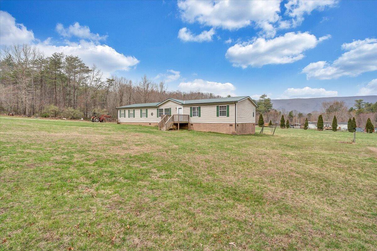 91 Homestead Road New Castle, VA 24127 - Photo 41 of 44 a view of a big yard with large trees