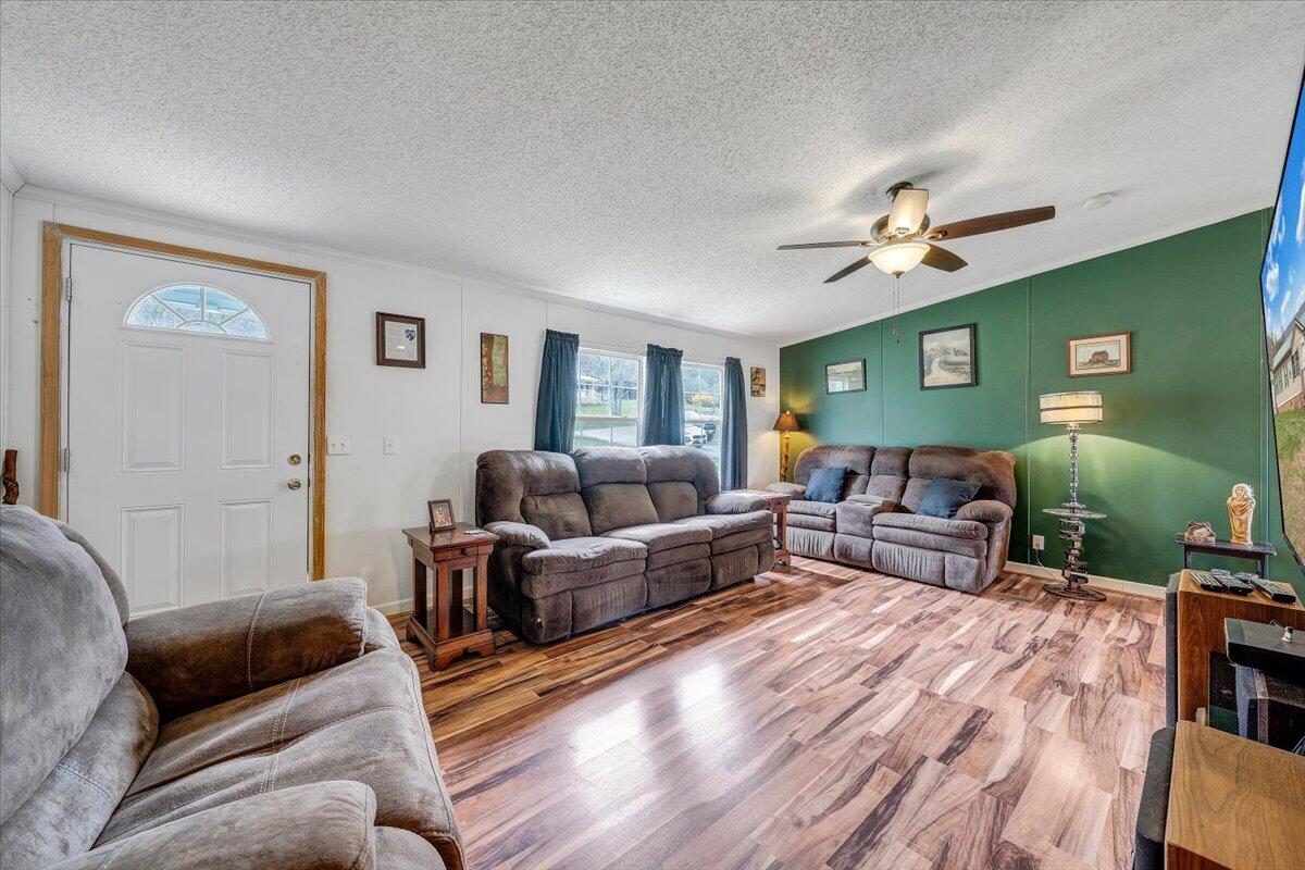 91 Homestead Road New Castle, VA 24127 - Photo 10 of 44 a living room with furniture and a wooden floor