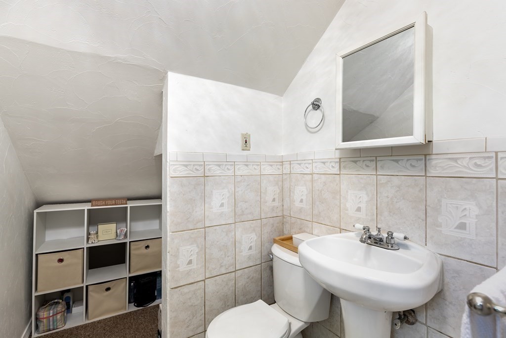 175 Hamilton Street Worcester, MA 01604 - Photo 14 of 21 a bathroom with a sink a toilet and mirror