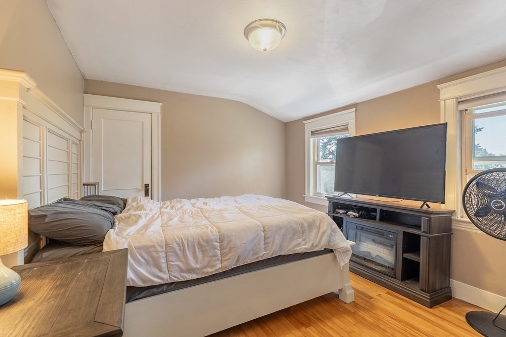 175 Hamilton Street Worcester, MA 01604 - Photo 16 of 21 a bedroom with a bed and a flat screen tv