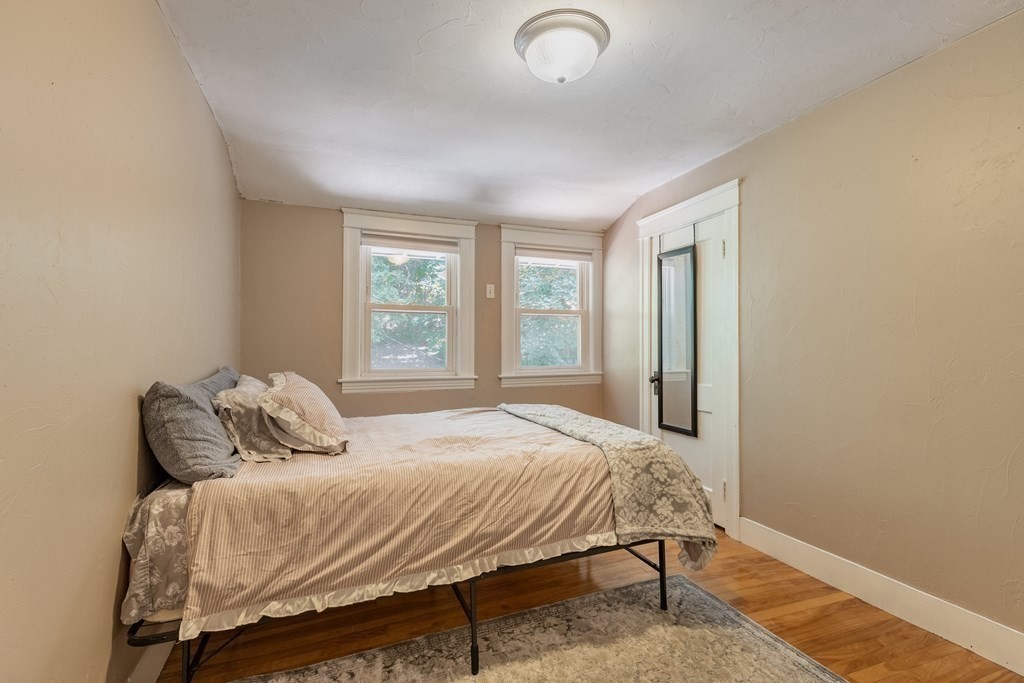 175 Hamilton Street Worcester, MA 01604 - Photo 17 of 21 a bedroom with a bed and window