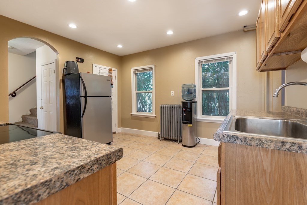 175 Hamilton Street Worcester, MA 01604 - Photo 7 of 21 a kitchen with refrigerator and faucet