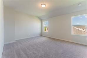 15107 Ryman Road Pflugerville, TX 78660 - Photo 14 of 34 an empty room with windows