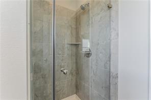 15107 Ryman Road Pflugerville, TX 78660 - Photo 21 of 34 a bathroom with a shower