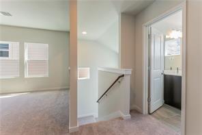 15107 Ryman Road Pflugerville, TX 78660 - Photo 24 of 34 an empty room with windows