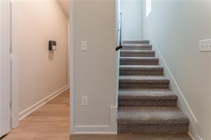 15107 Ryman Road Pflugerville, TX 78660 - Photo 7 of 34 a view of staircase with white walls
