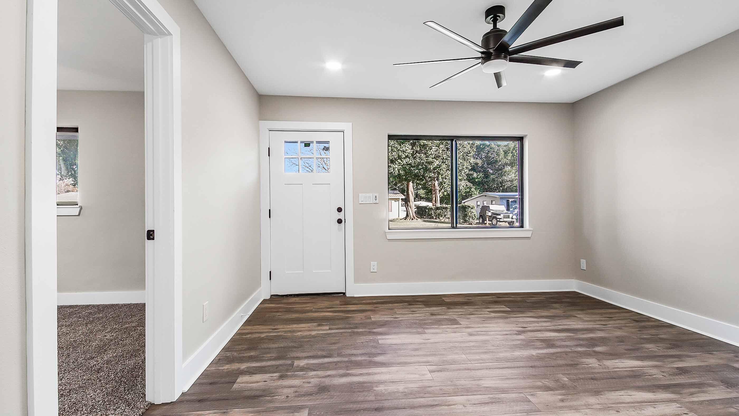 415 Avon Lane Mary Esther, FL 32569 - Photo 14 of 40 wooden floor in an empty room with a window