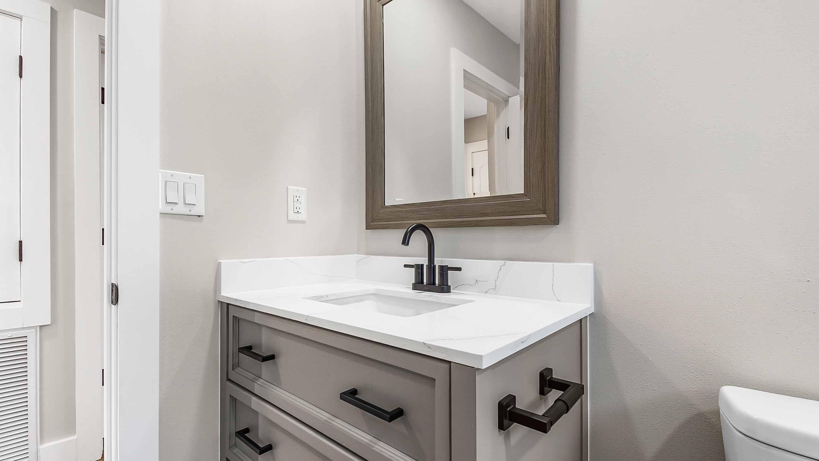 415 Avon Lane Mary Esther, FL 32569 - Photo 17 of 40 a bathroom with a sink and a mirror