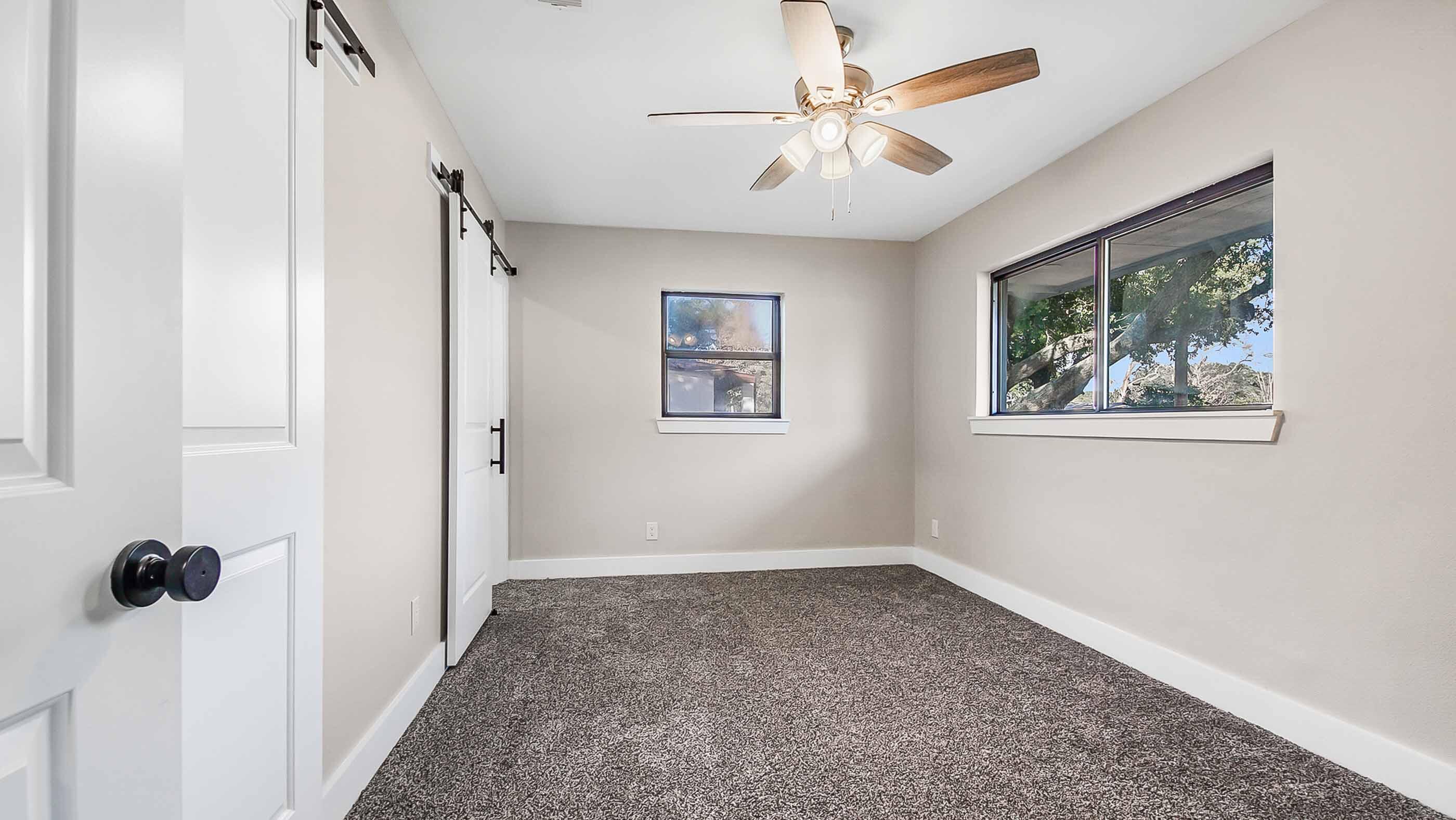 415 Avon Lane Mary Esther, FL 32569 - Photo 25 of 40 an empty room with windows and fan