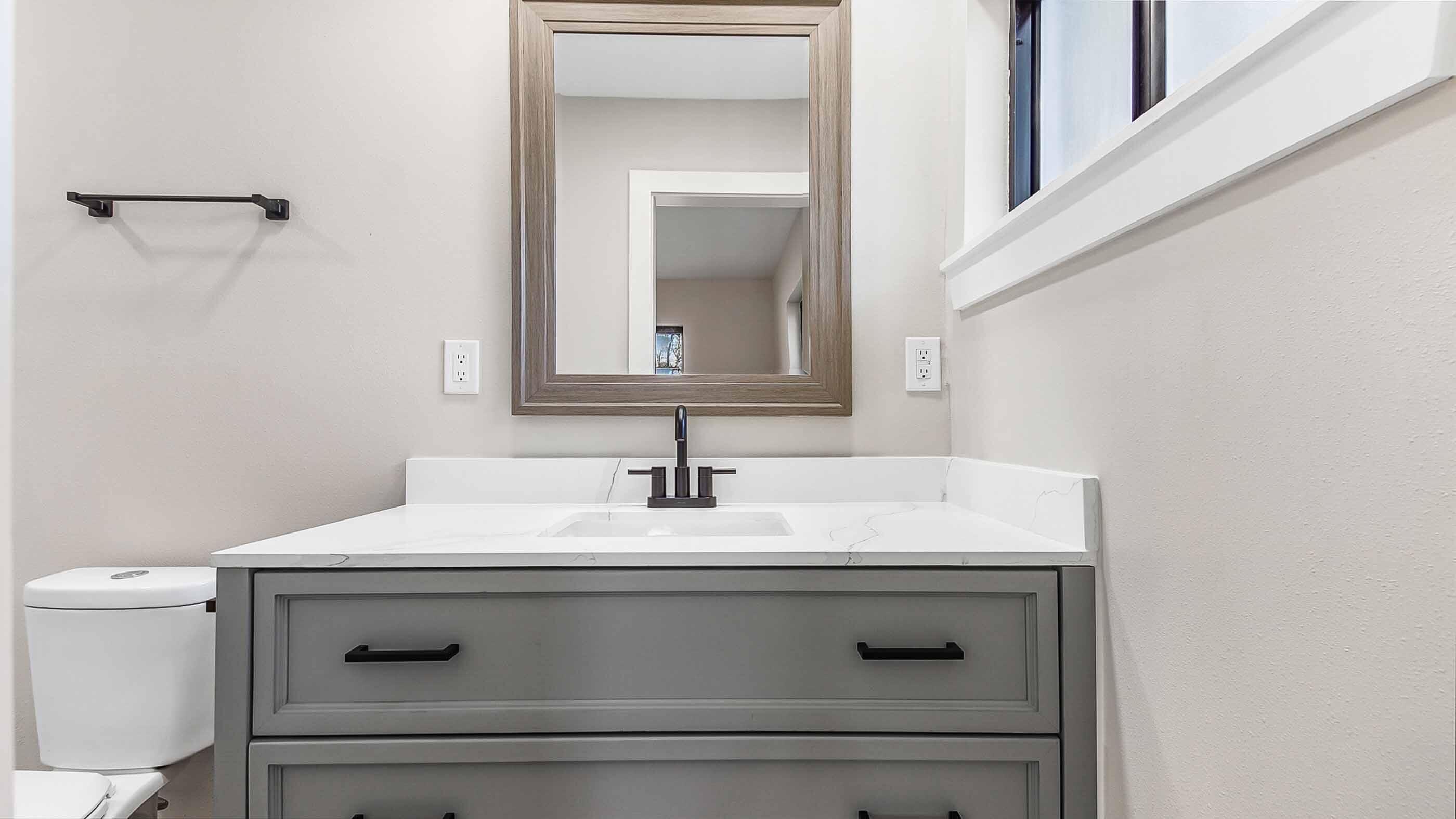 415 Avon Lane Mary Esther, FL 32569 - Photo 28 of 40 a bathroom with a sink and a mirror