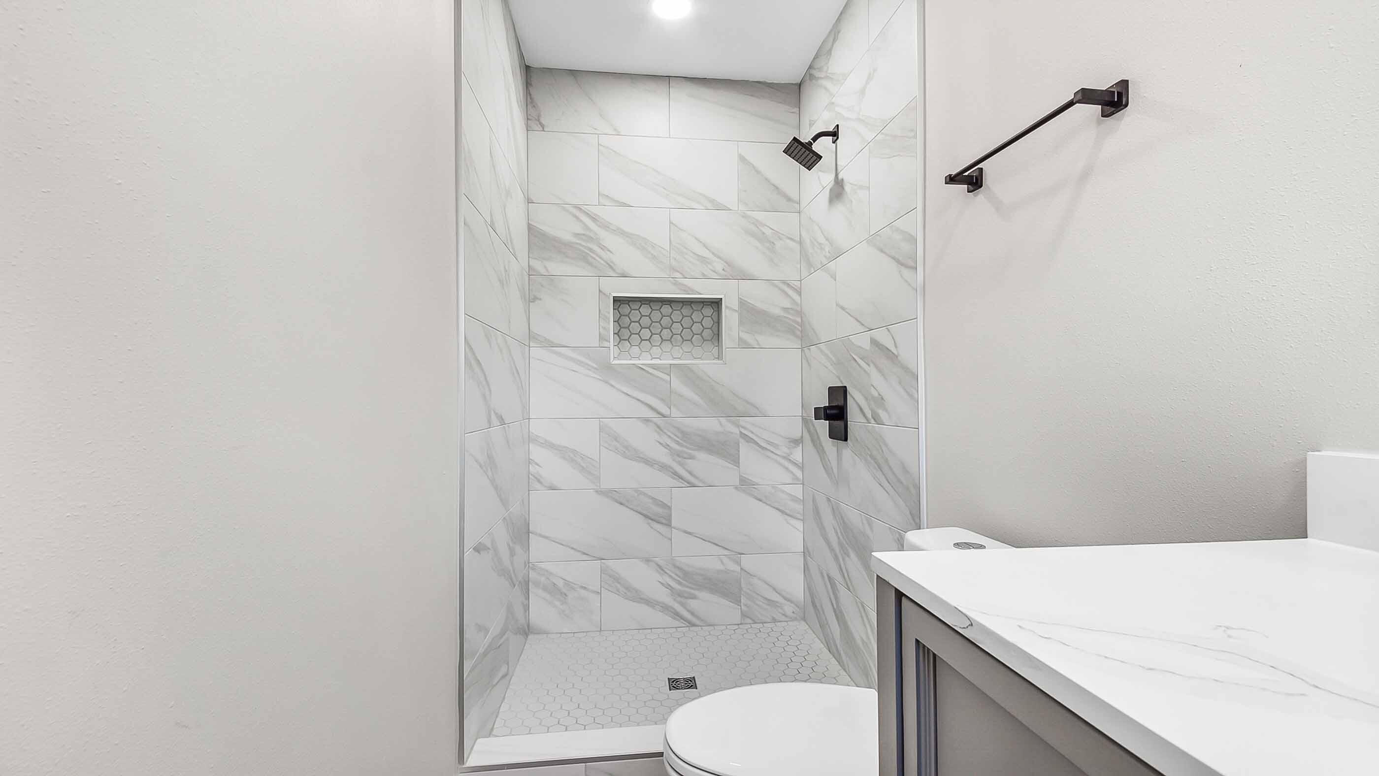 415 Avon Lane Mary Esther, FL 32569 - Photo 29 of 40 a bathroom with a sink a toilet and shower