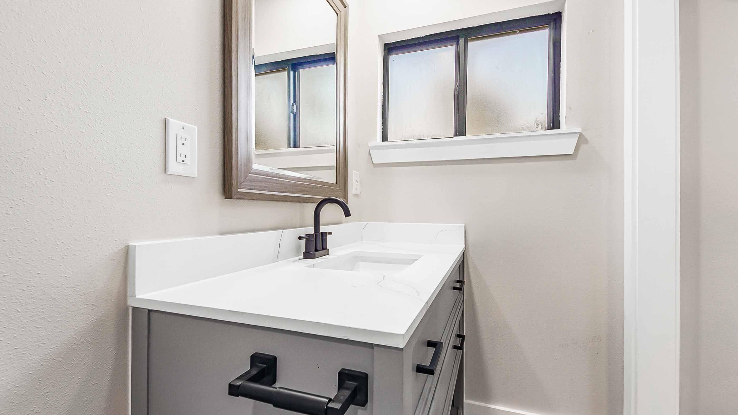 415 Avon Lane Mary Esther, FL 32569 - Photo 30 of 40 a bathroom with a sink and a mirror