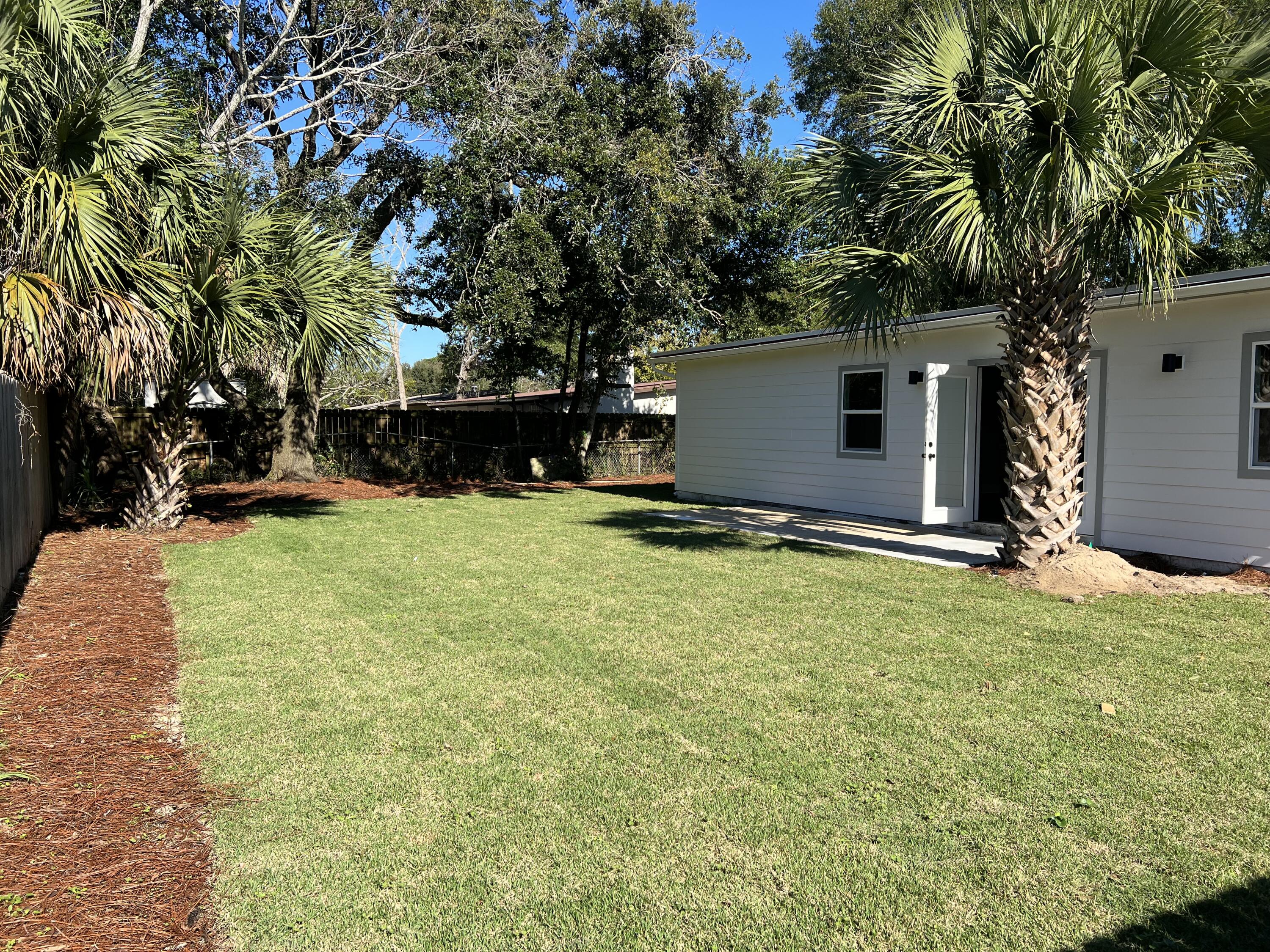415 Avon Lane Mary Esther, FL 32569 - Photo 38 of 40 a view of a backyard with a tree