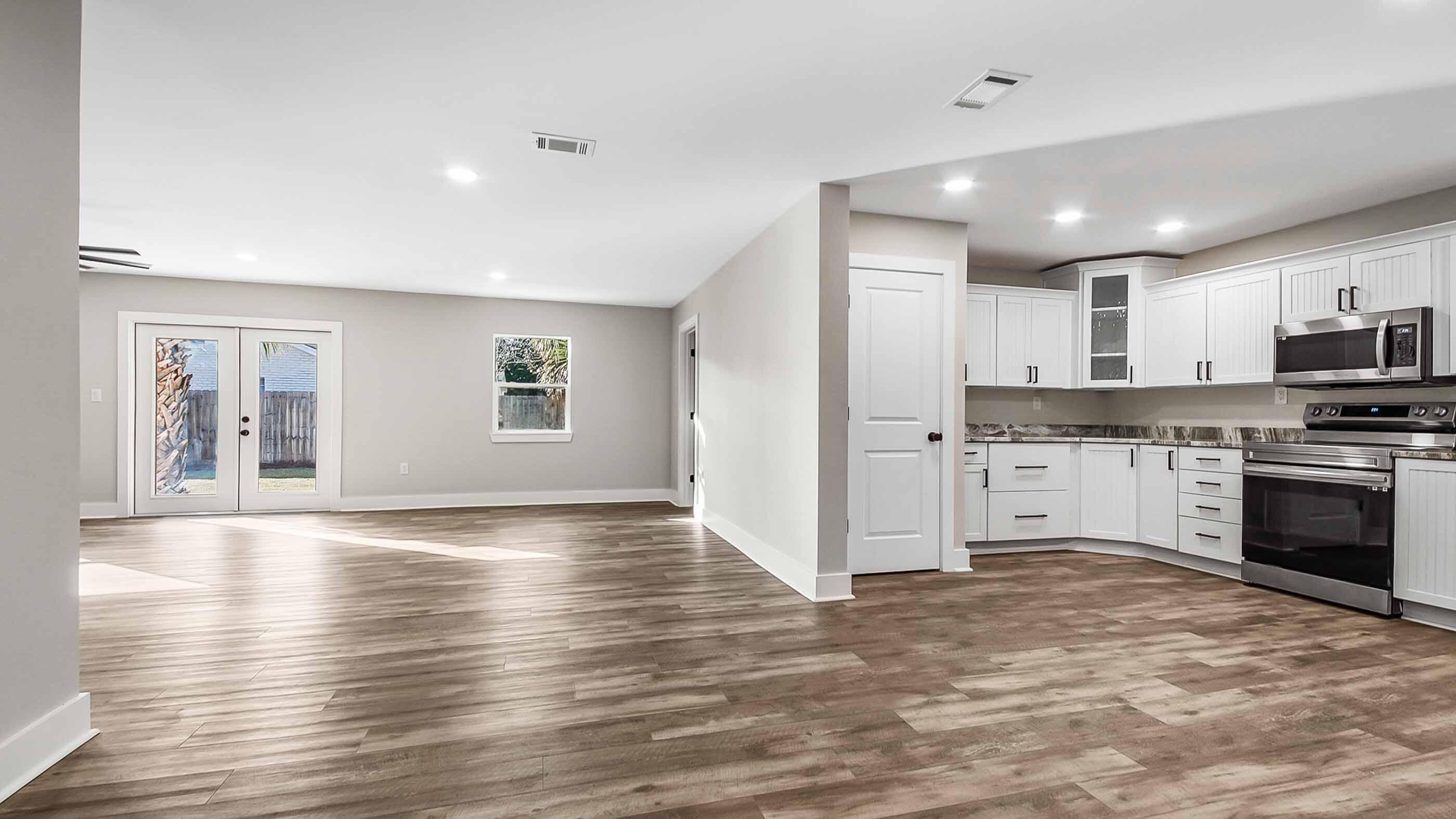 415 Avon Lane Mary Esther, FL 32569 - Photo 4 of 40 a large kitchen with stainless steel appliances granite countertop a stove and a refrigerator