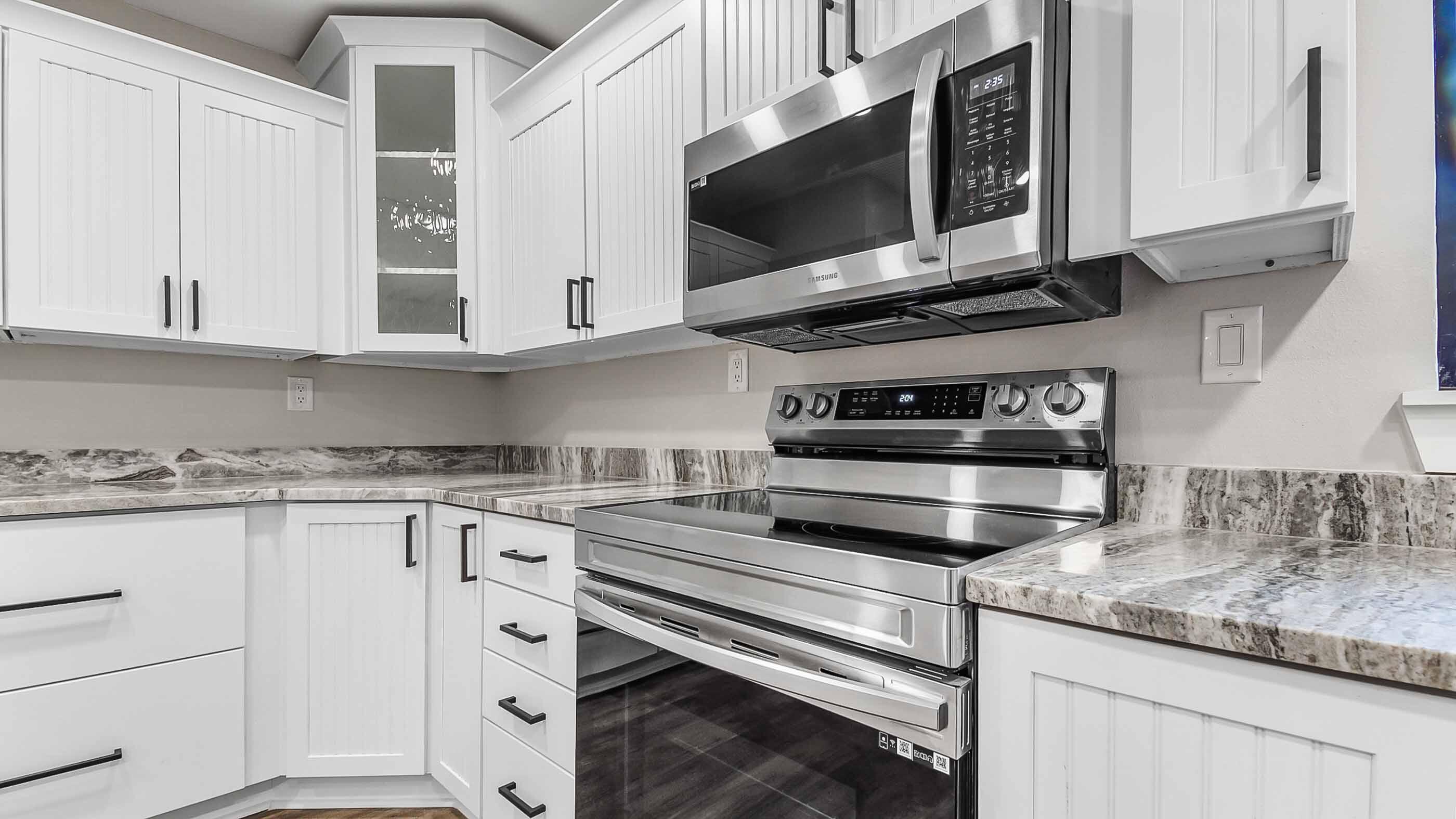 415 Avon Lane Mary Esther, FL 32569 - Photo 6 of 40 a kitchen with stainless steel appliances granite countertop a sink and a stove