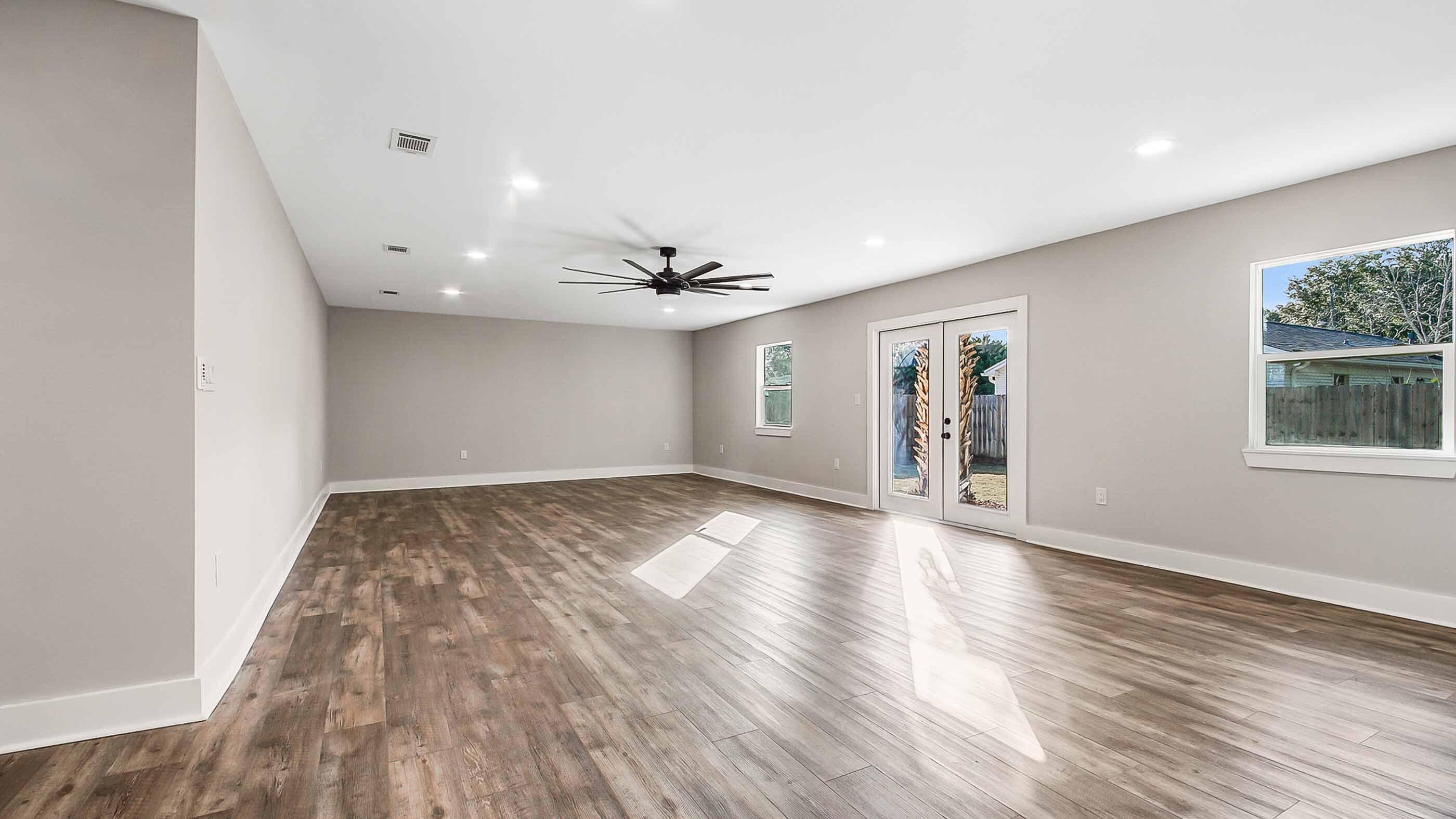 415 Avon Lane Mary Esther, FL 32569 - Photo 8 of 40 a view of empty room with wooden floor and fan