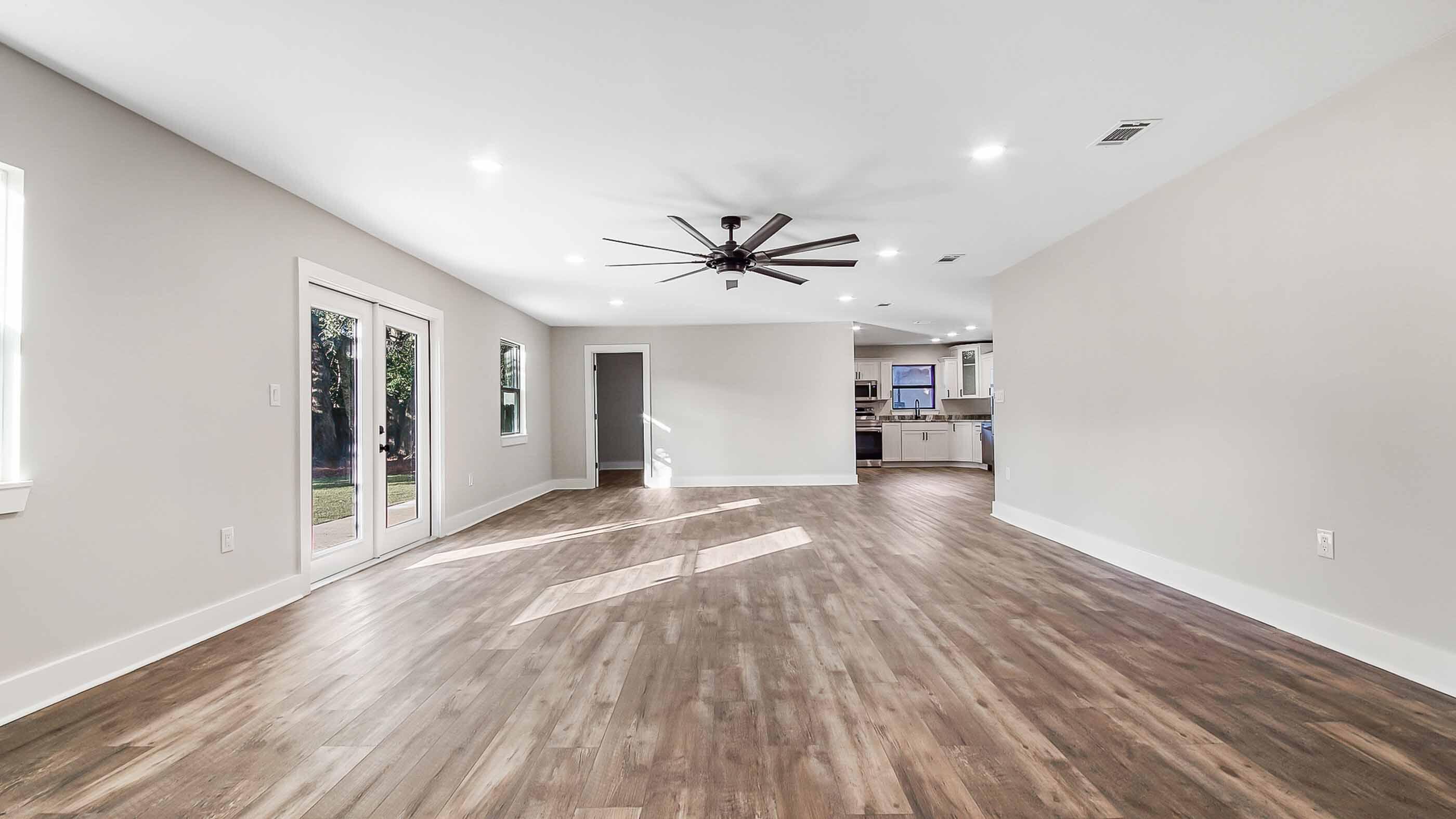 415 Avon Lane Mary Esther, FL 32569 - Photo 9 of 40 a view of a livingroom with a hardwood floor and a ceiling fan