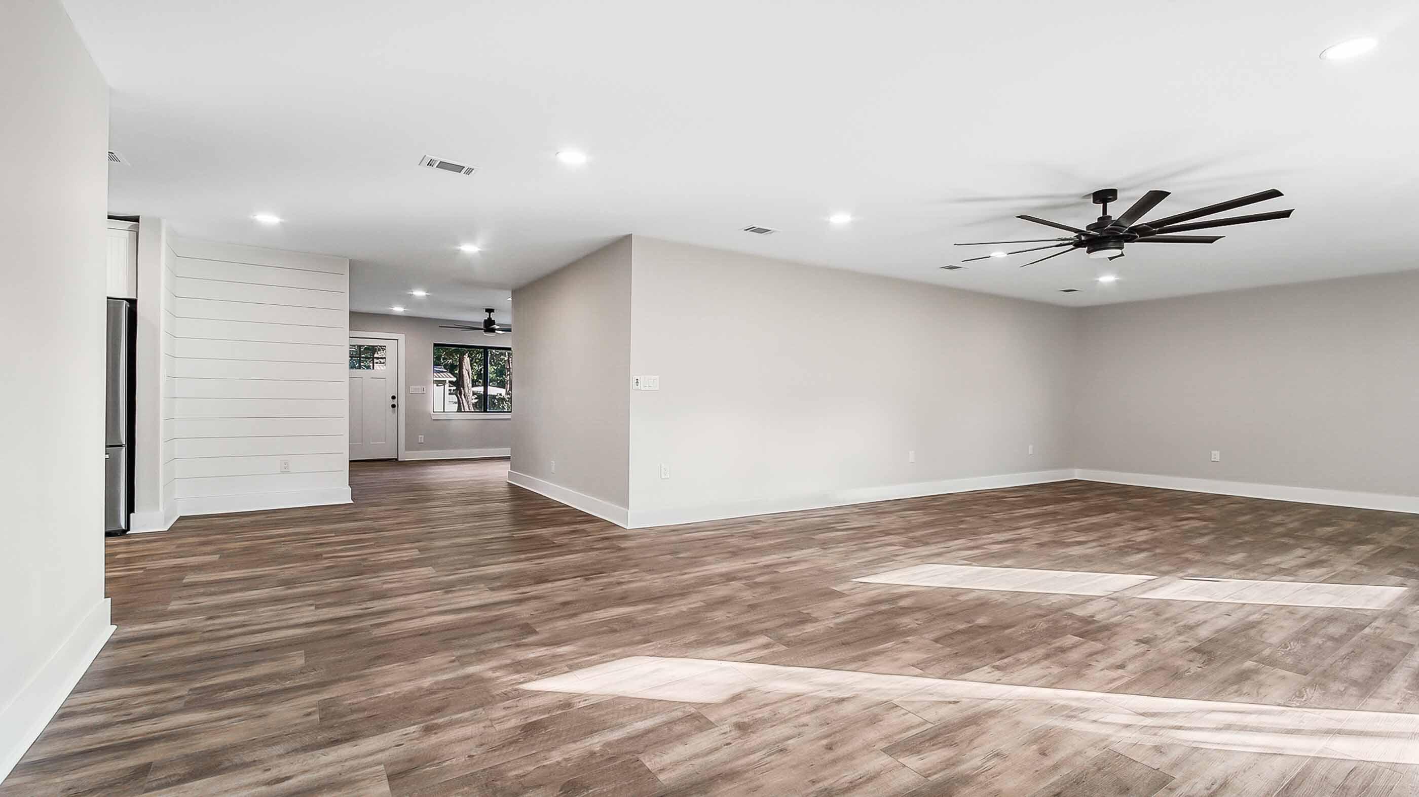 415 Avon Lane Mary Esther, FL 32569 - Photo 10 of 40 a view of a livingroom with a ceiling fan and wooden floor