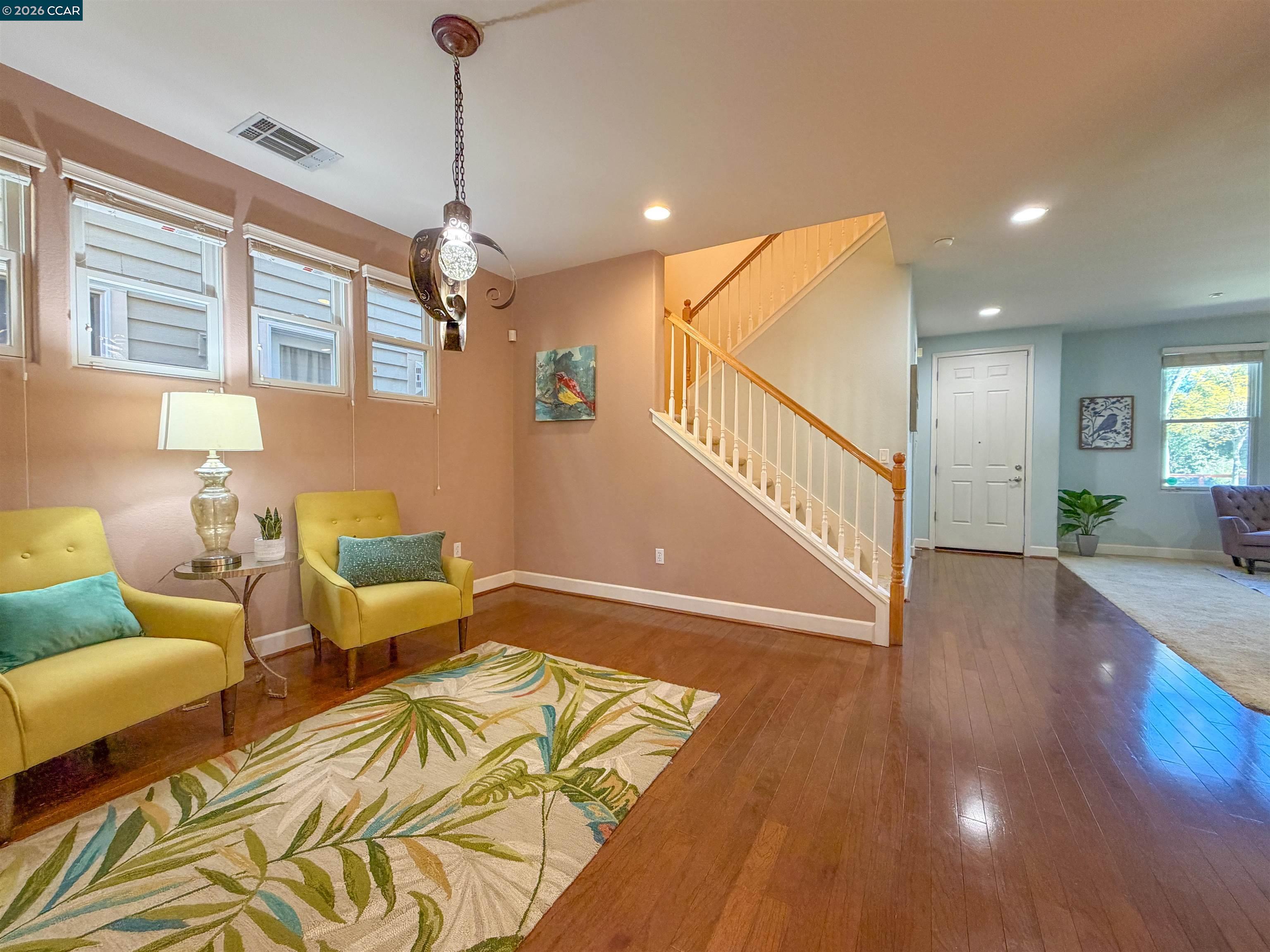 3198 South Front Street Hercules, CA 94547 - Photo 11 of 33 a living room with furniture and a wooden floor