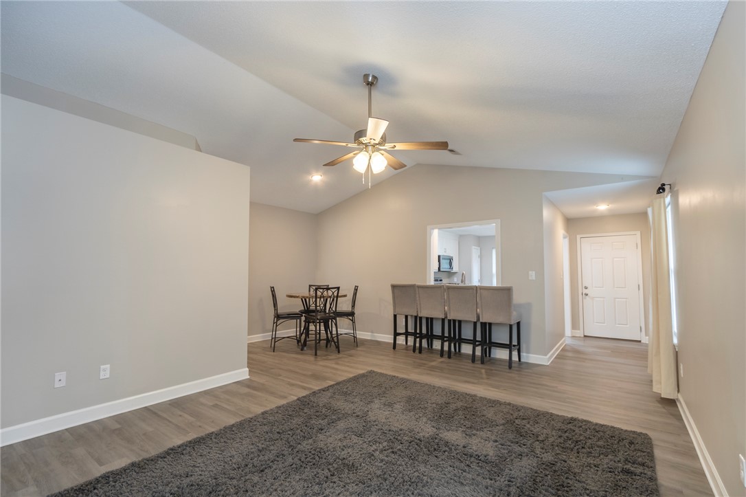 2509 Rolling Green Road Anderson, SC 29621 - Photo 10 of 28 A vaulted ceiling living area flows into a functional dining space and kitchen pass-through.