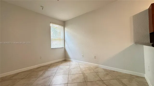 an empty room with a empty space and a window