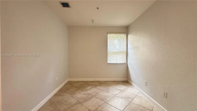 a view of entryway and hall with a window