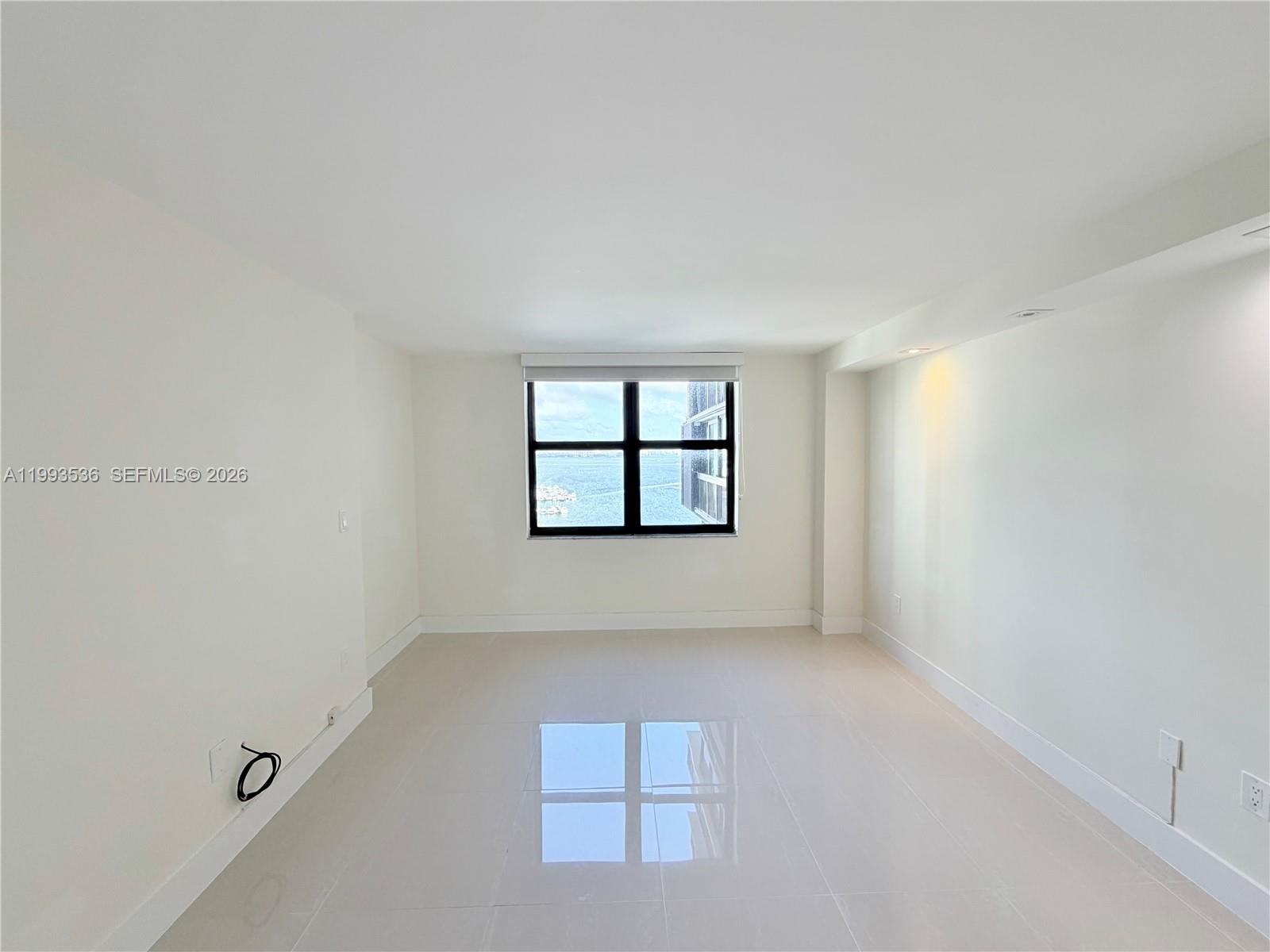 2333 Brickell Avenue, Unit 1407 Miami, FL 33129 - Photo 15 of 38 an empty room with windows