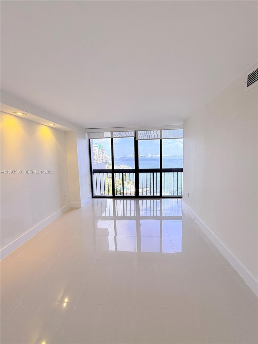 2333 Brickell Avenue, Unit 1407 Miami, FL 33129 - Photo 17 of 38 a view of an empty room with a window