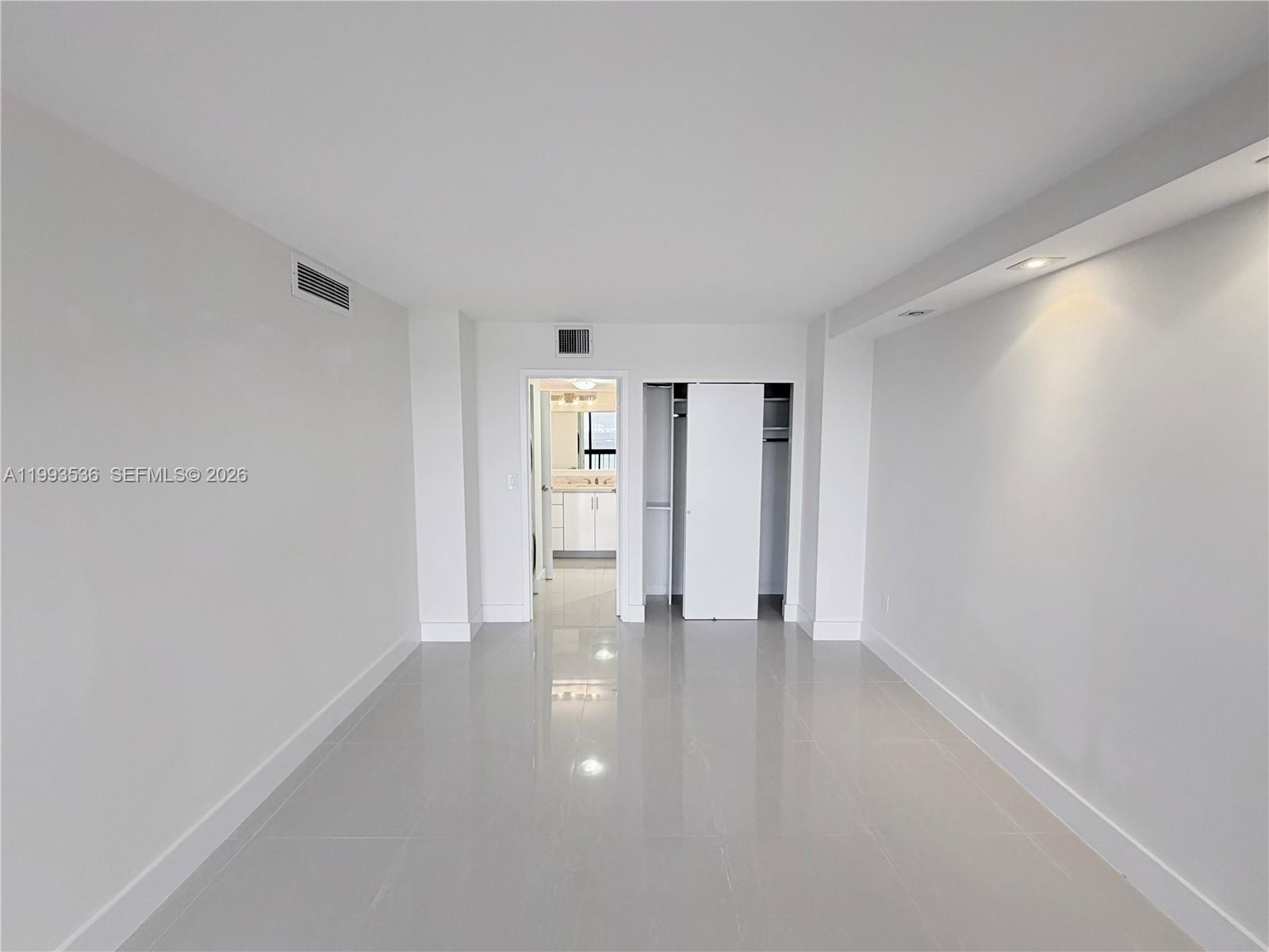 2333 Brickell Avenue, Unit 1407 Miami, FL 33129 - Photo 19 of 38 a view of an empty room and window