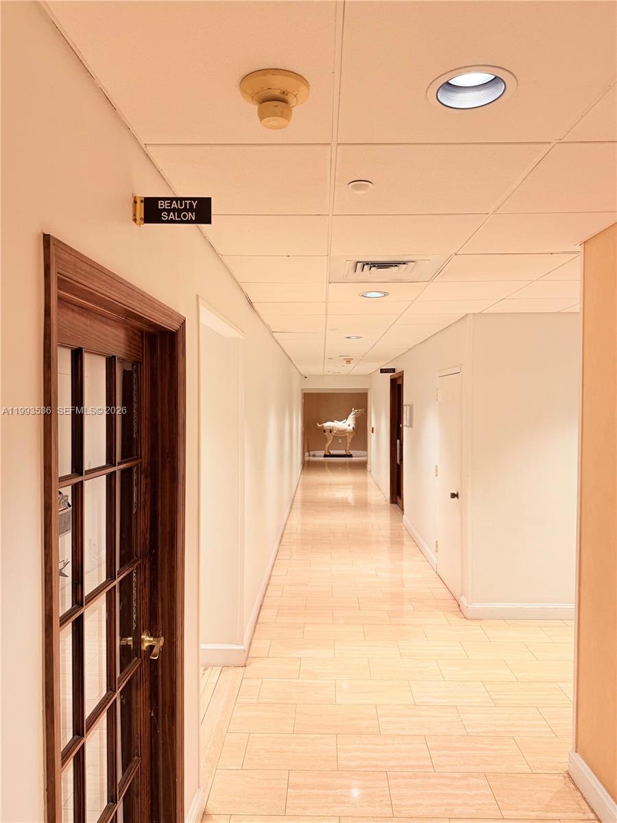 2333 Brickell Avenue, Unit 1407 Miami, FL 33129 - Photo 35 of 38 a view of a hallway with wooden floor