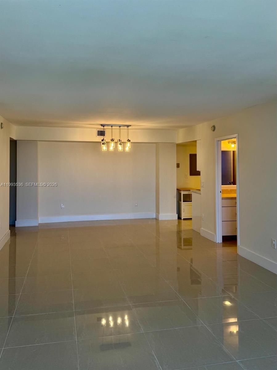 2333 Brickell Avenue, Unit 1407 Miami, FL 33129 - Photo 5 of 38 a view of kitchen with refrigerator and window