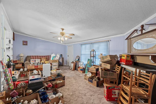 a living room with lots of furniture and a chandelier