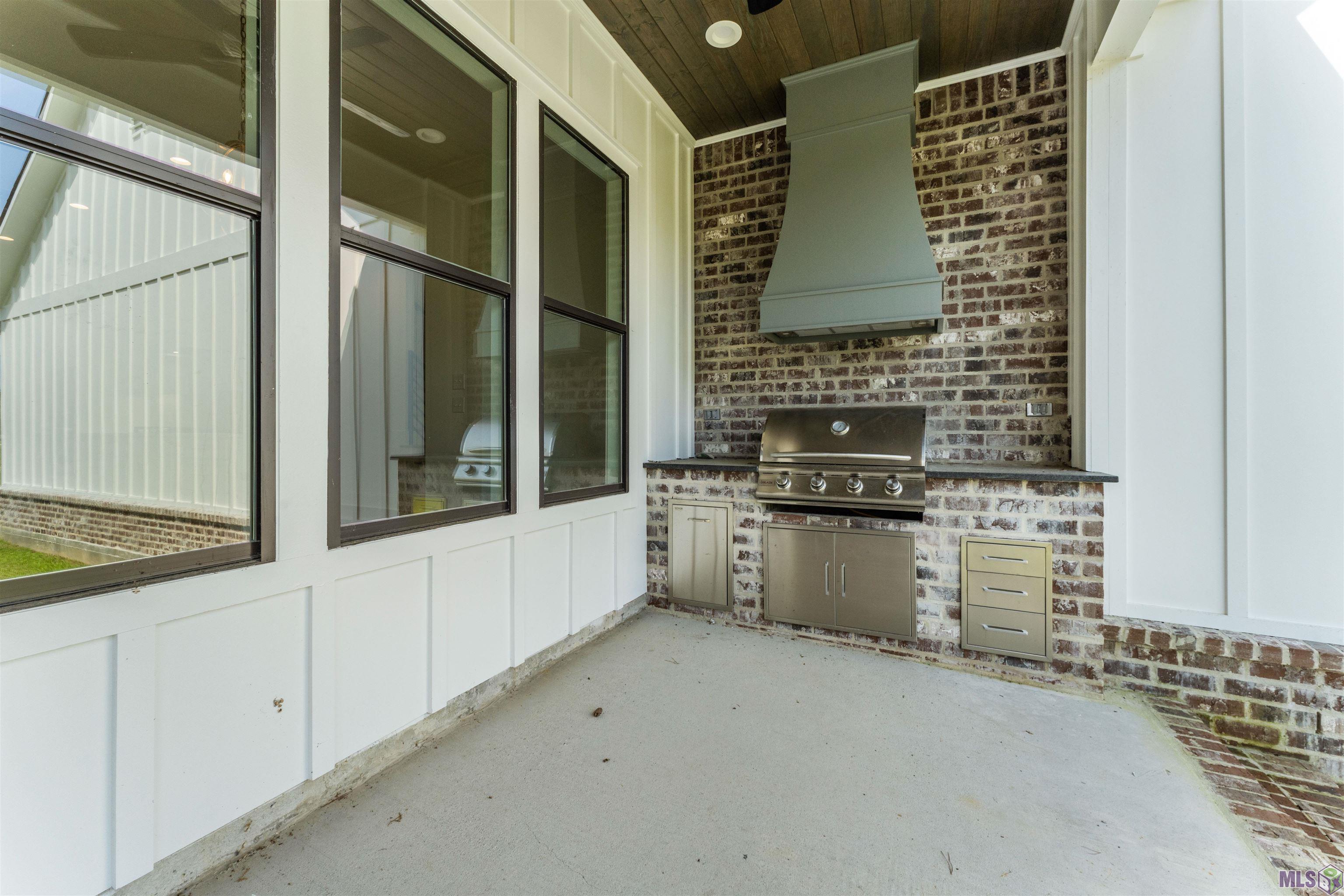 9053 Hillon Hood Road Denham Springs, LA 70726 - Photo 42 of 51 Outdoor Kitchen with Custom Vent Hood